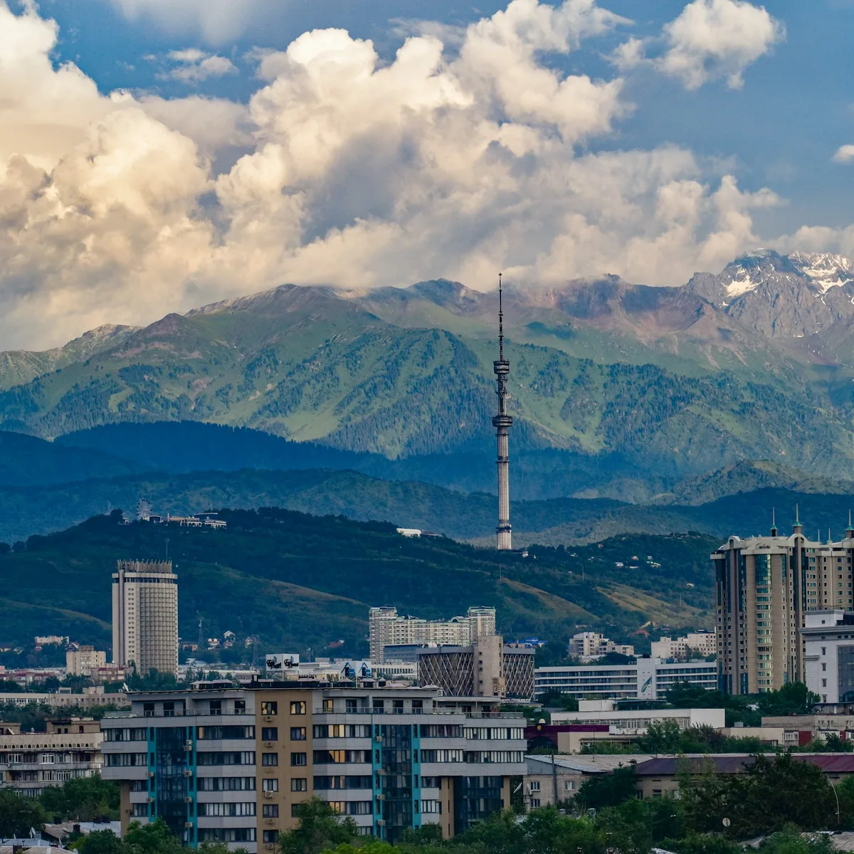 A city with a mountain in the background, Almaty