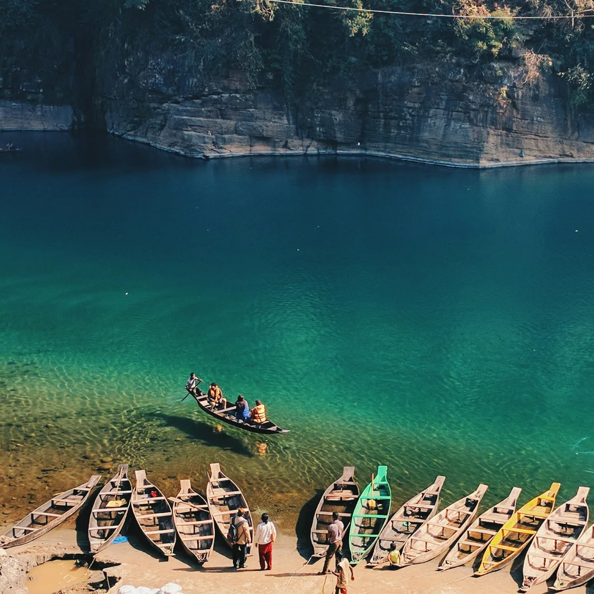 Landscape photo of boats near body of water, Meghalaya