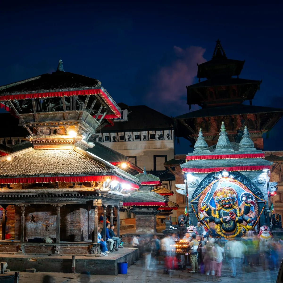 A group of people that are standing in front of a building, Nepal