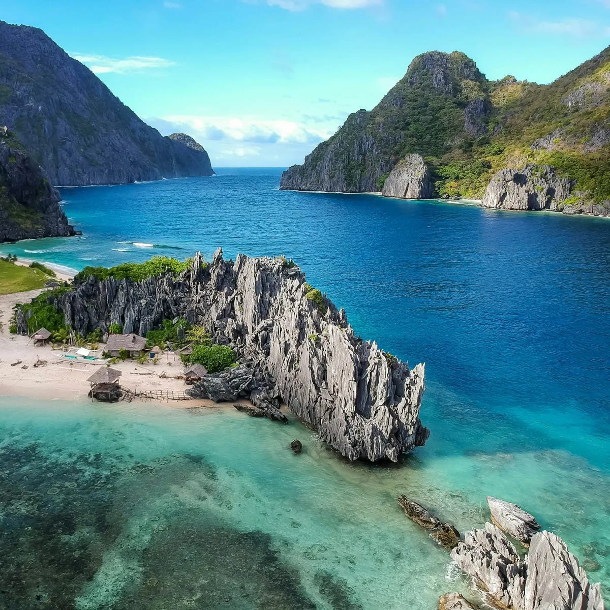 Aerial photo of body of water between mountains, Philippines