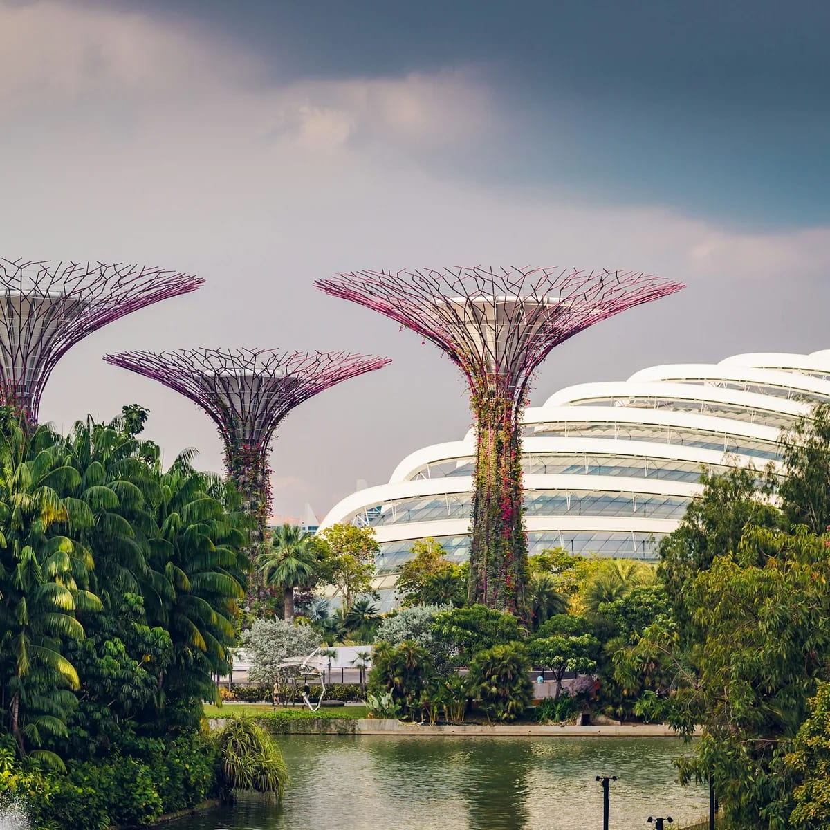 Three multicolored landmarks under blue and white sky, Singapore