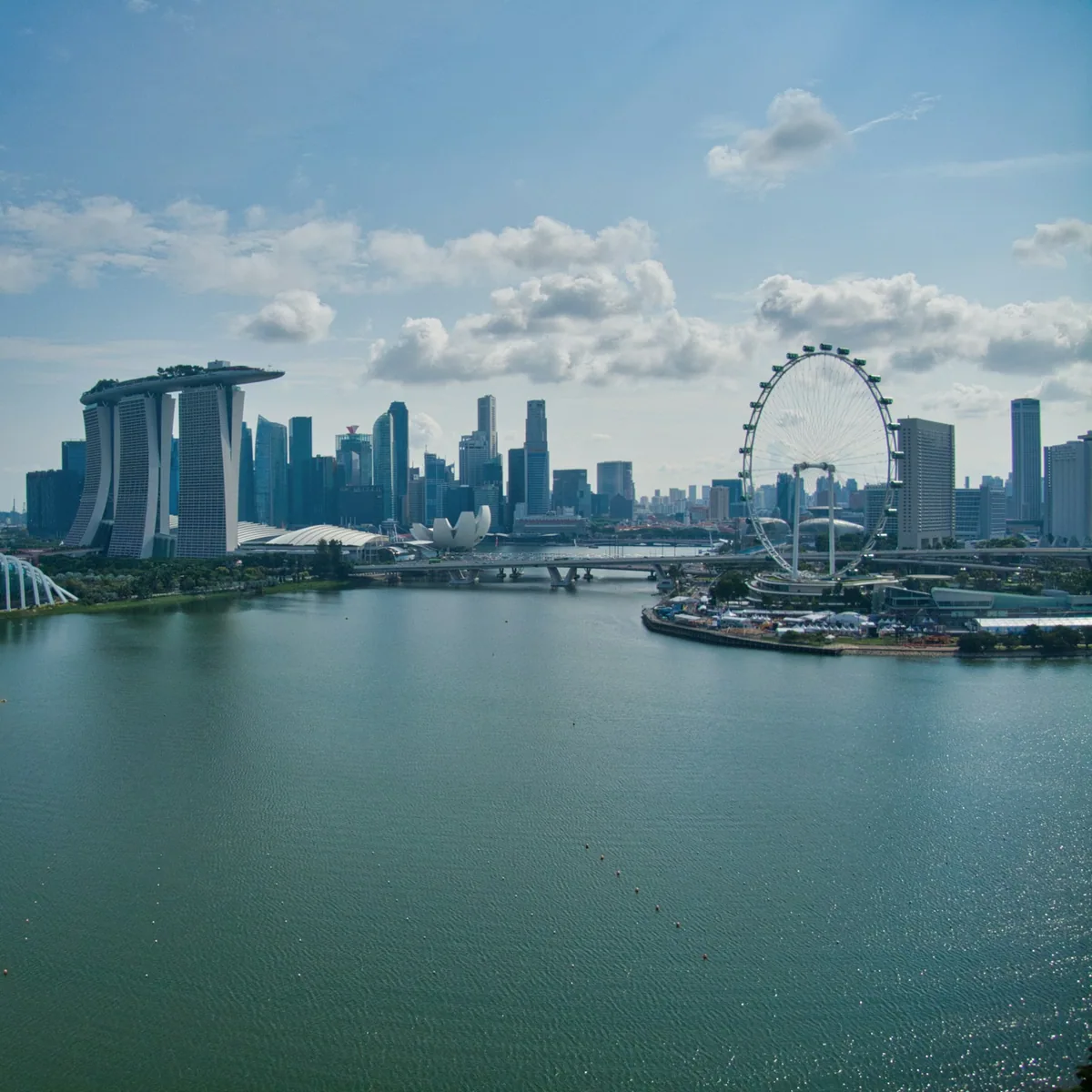 White boat on water near city buildings during daytime, Singapore