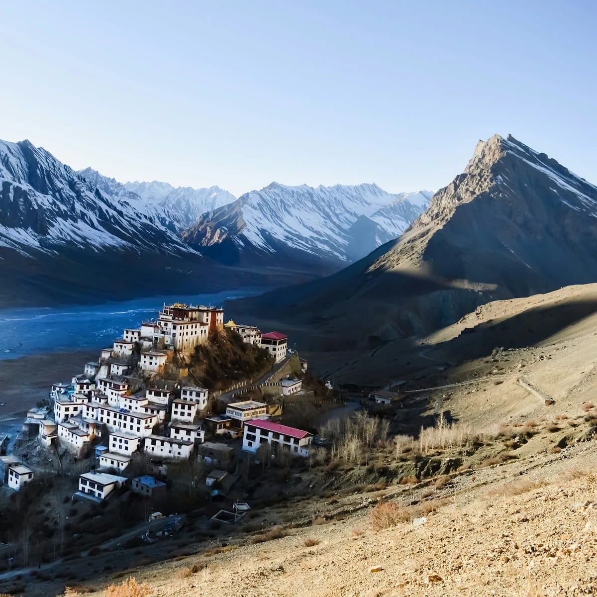 A mountain village nestled between majestic snowy peaks, Spiti Valley