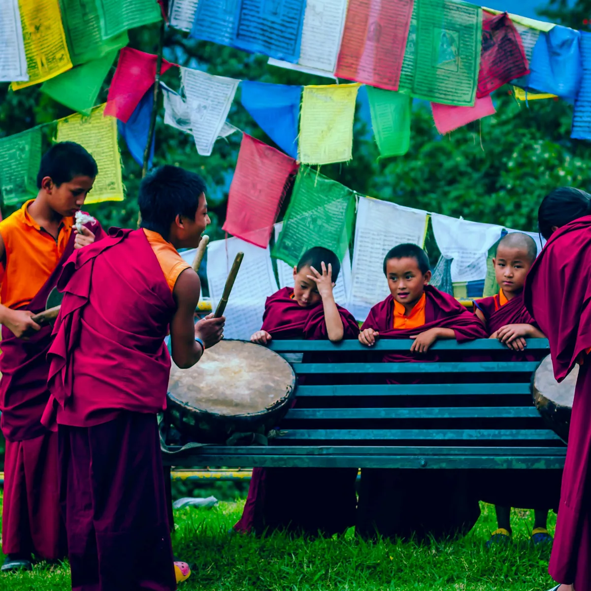 Boys playing drums near towels at daytime, Sikkim