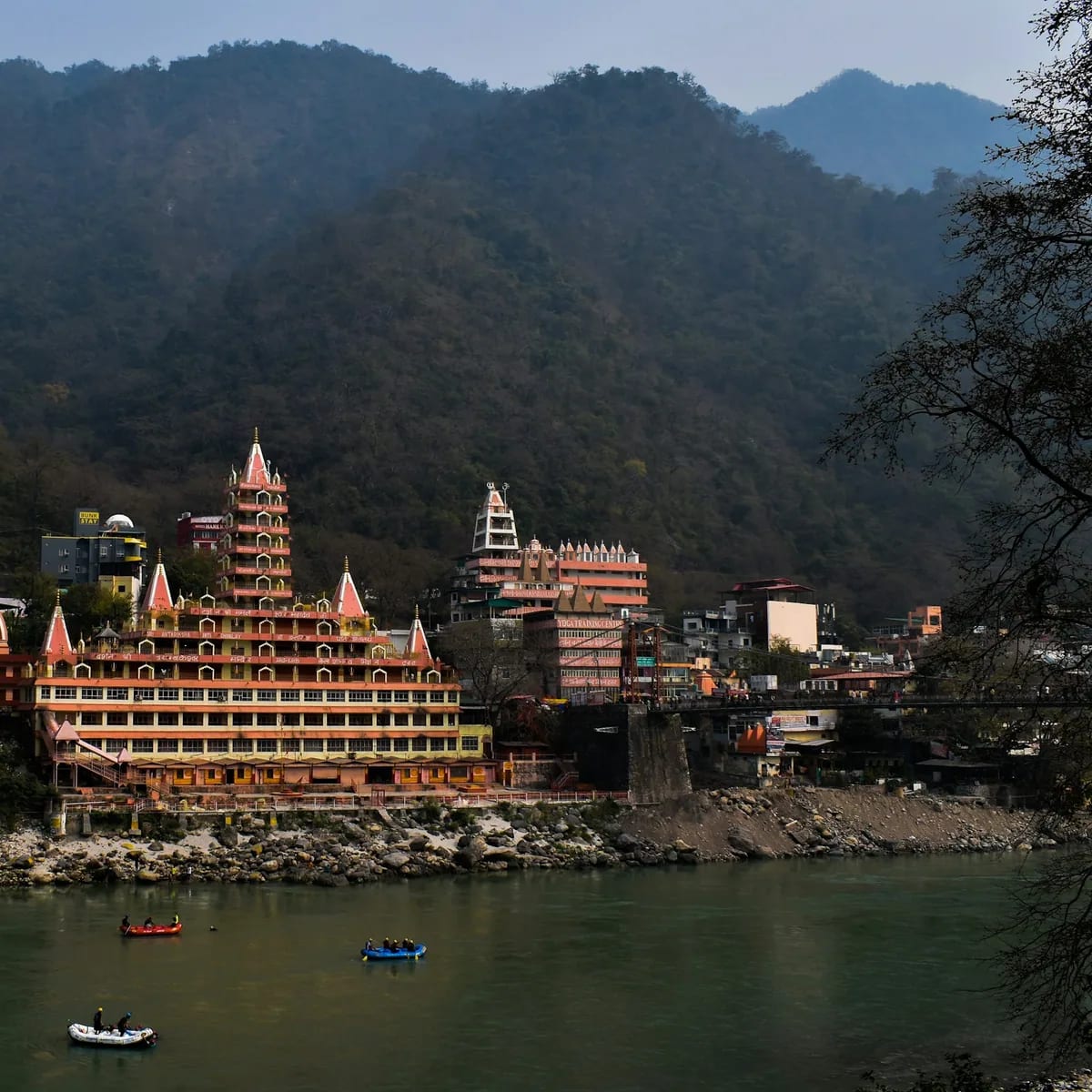 A body of water with a large building in the middle of it, Mussoorie & Rishikesh